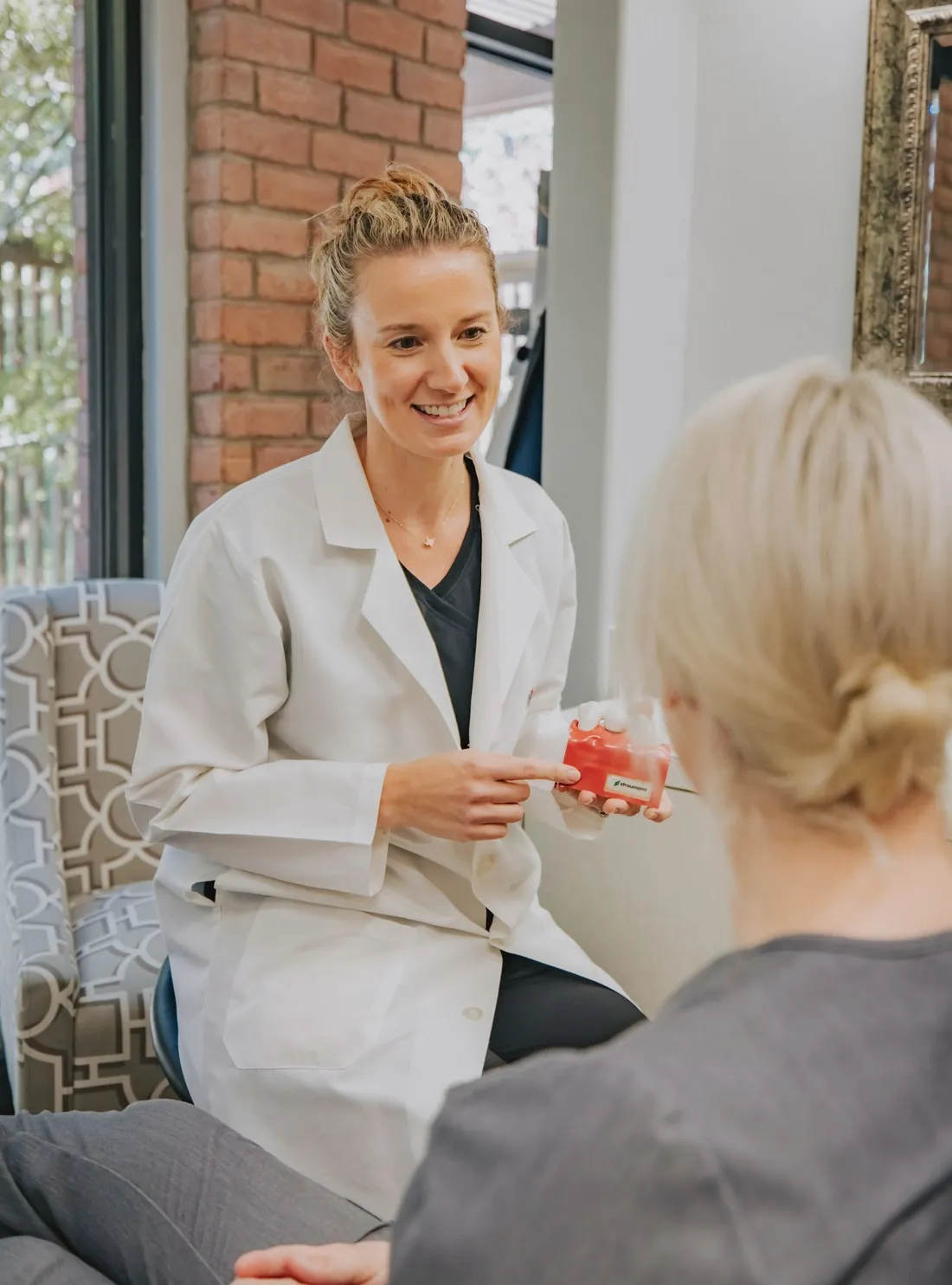 A Beautologie provider talking a patient through her treatment plan